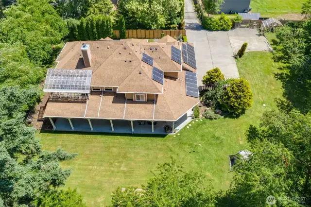 Wonderful drone shot of the back of the house.  Gated private drive, with plenty off RV, off street parking!