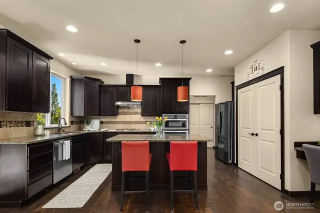 Convenient island and oversized pantry.