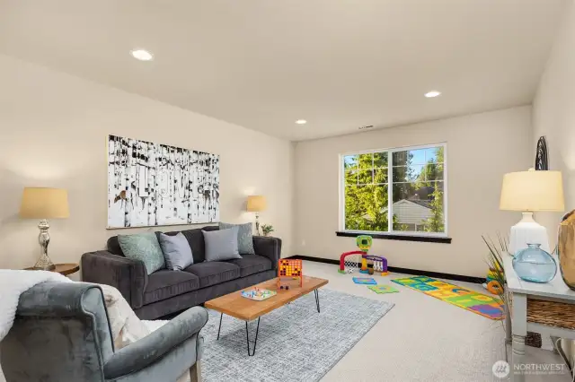 Upstairs bonus room is perfect for media or play.