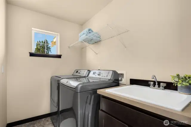 Laundry room with utility sink conveniently located on the seconf floor.