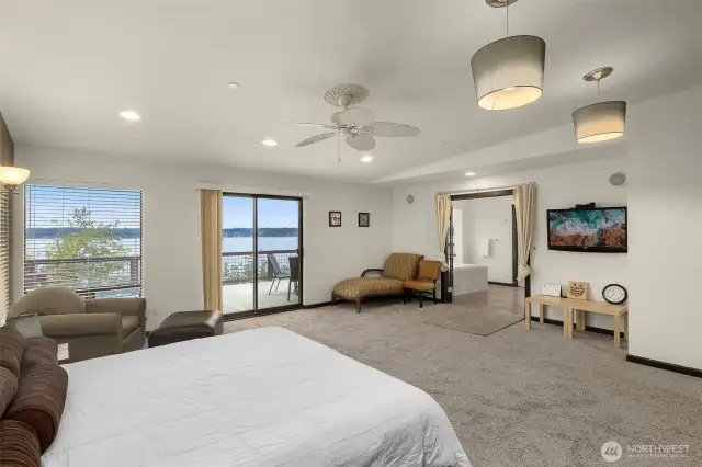 Another view of the primary suite balcony access and ensuite bathroom.