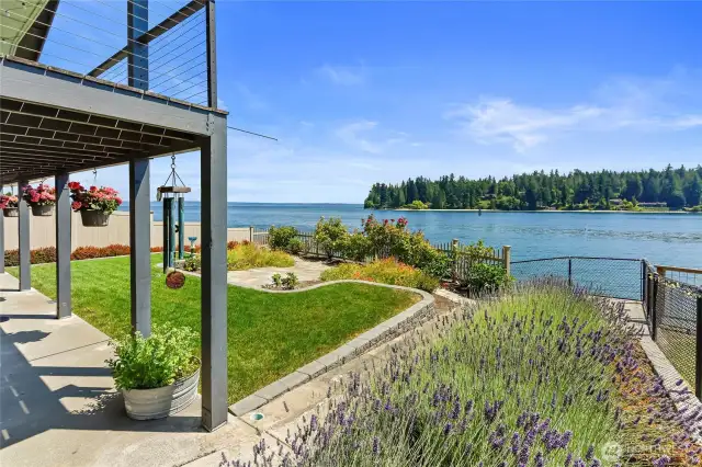 From the patio, you can see the landing to the ramp to the beach beyond the lavender bed.