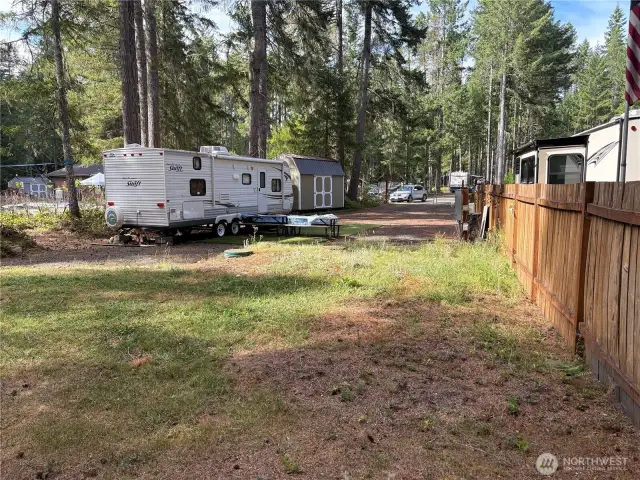 compltely fenced on the left side of the property