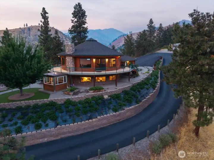 Paved driveway and extensive landscaping