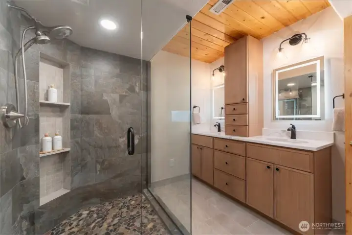 Completely remodeled primary bathroom with walk-in shower & dual vanity