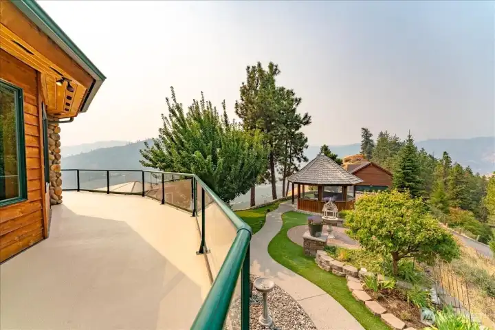 Refinished waterproof deck with glass railing
