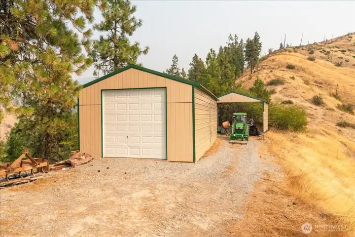 18x32 garage with concrete floor and carport