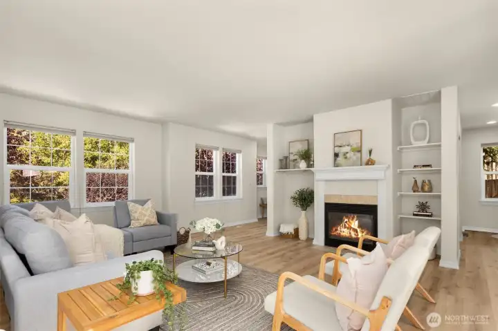 Spacious living room with gas fireplace. Surround yourself in windows!
