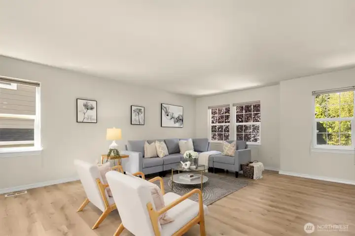 Oversized living room with new laminate wood flooring.