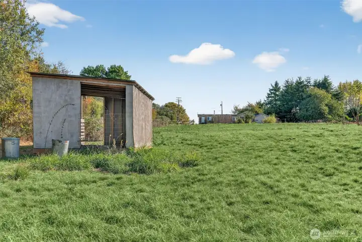 Loafing shed on flat pastoral land.