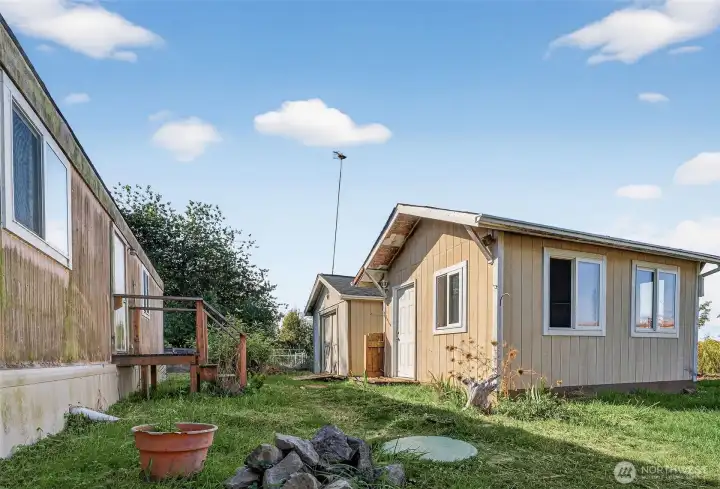 Oubuildings include a finished shed and garden shed.