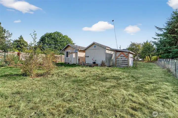 Outbuilding have a yard/garden in the back.