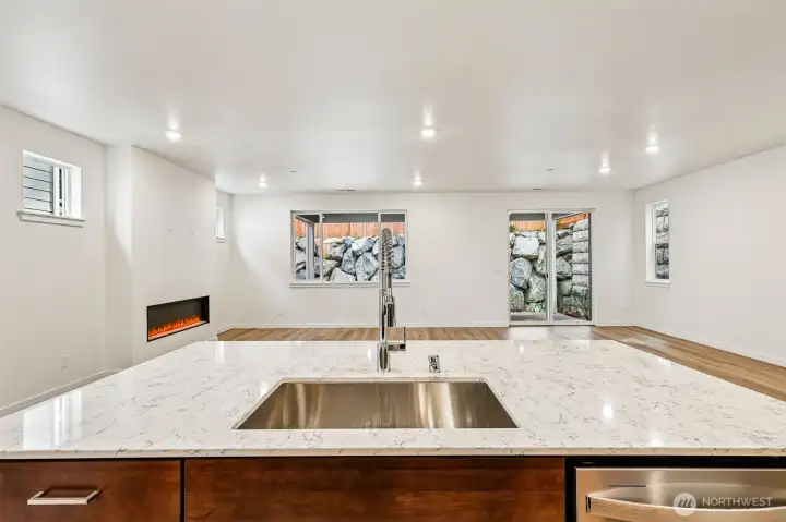 Kitchen island with sink, dishwasher, and storage cabinets.