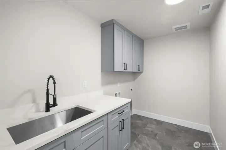 Laundry Room Conveniently Located Just off the Garage Entrance