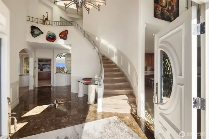 Note the inviting entry with high end finishes, details and marble floor with a deign highlight.