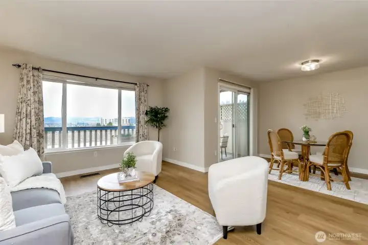 Living room facing the dining room and the kitchen is to the right of the dining room.