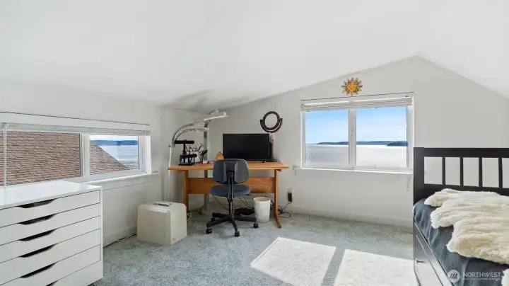 Loft bedroom has a view from both windows