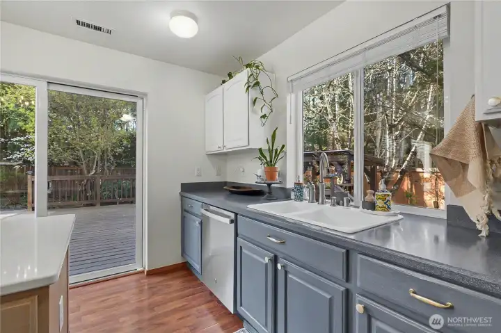 Kitchen overlooks the spacious back yard.
