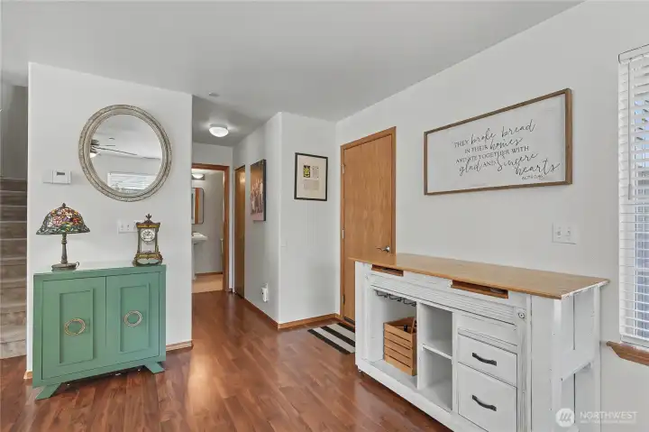 Garage door to the right.  Hall has a pantry closet and a coat closet for additional storage.