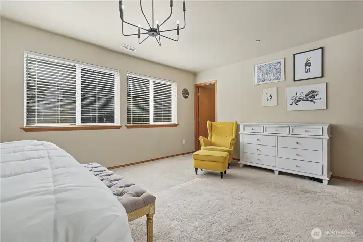 Primary bedroom suite overlooks the back yard.