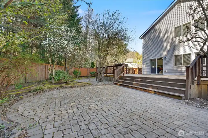 Updated patio work adjacent to the deck. Mature fruit trees in the yard.
