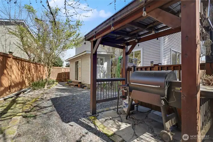 Covered BBQ station off the deck for cooking.