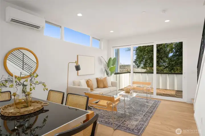 Sun-drenched living area perfect for hosting, with seamless indoor-outdoor flow.