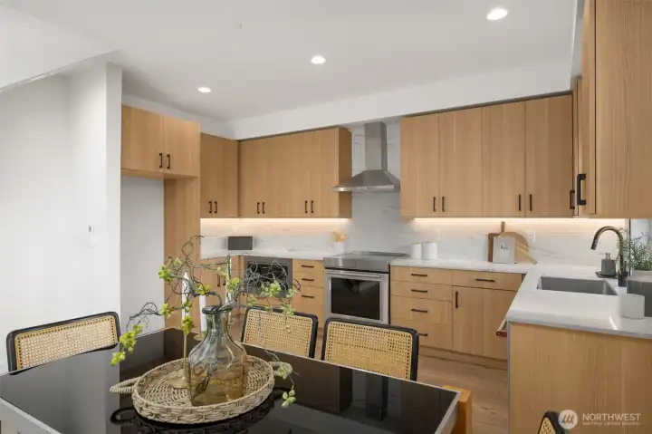 Well-appointed dining nook or secondary living area with designer lighting.