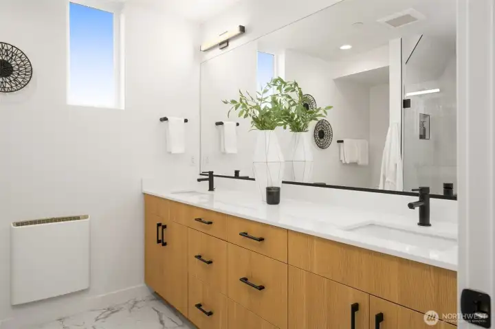 Sleek and clean bathroom design with premium hardware and vanity lighting.