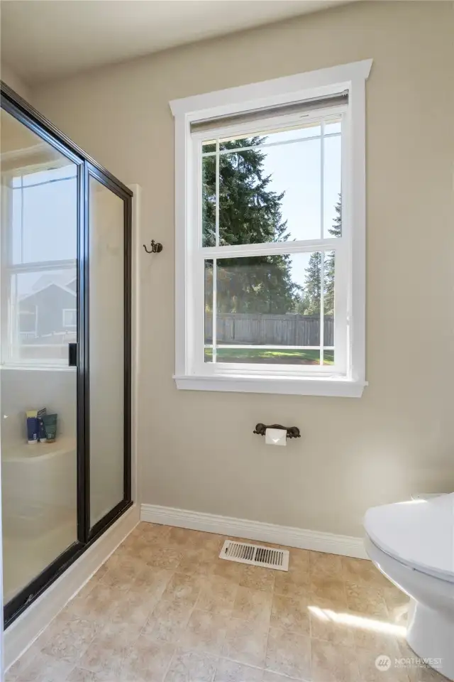 The primary bath features a separate shower area & dual shower heads