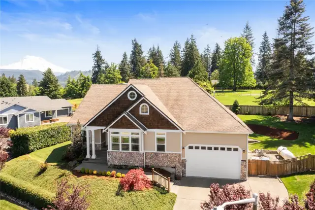 Breathtaking mountain views can be enjoyed from both inside and outside this beautifully upgraded home.