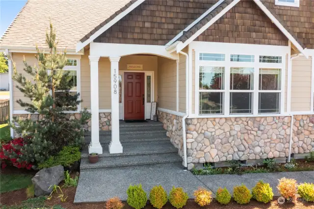 Gorgeous entry with custom painted door welcomes you home.