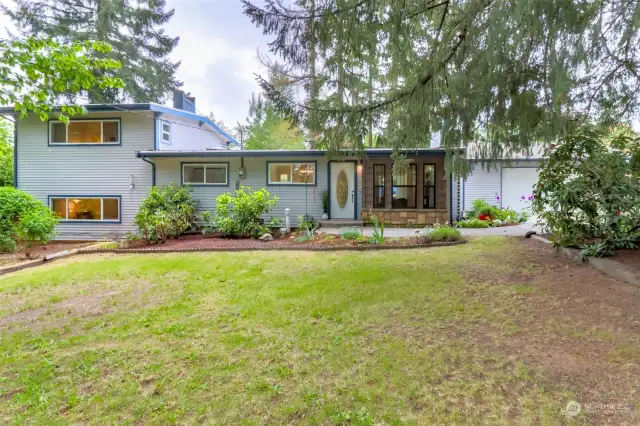 Welcome home to this mid-century tri-level home w/designer touches