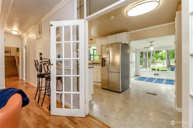 Exquisite antique french doors from the living room to the kitchen.