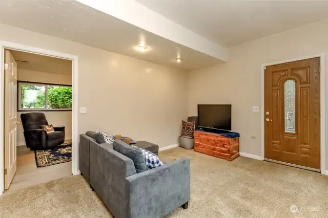 The lower level offers a cozy family room and the 3rd bedroom.