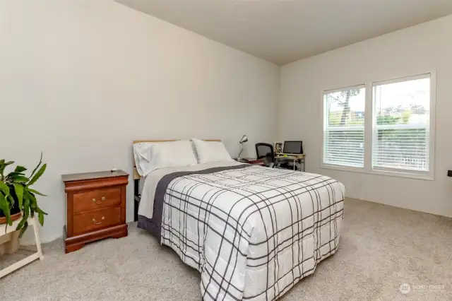 Primary bedroom with walk in closet and en-suite bathroom