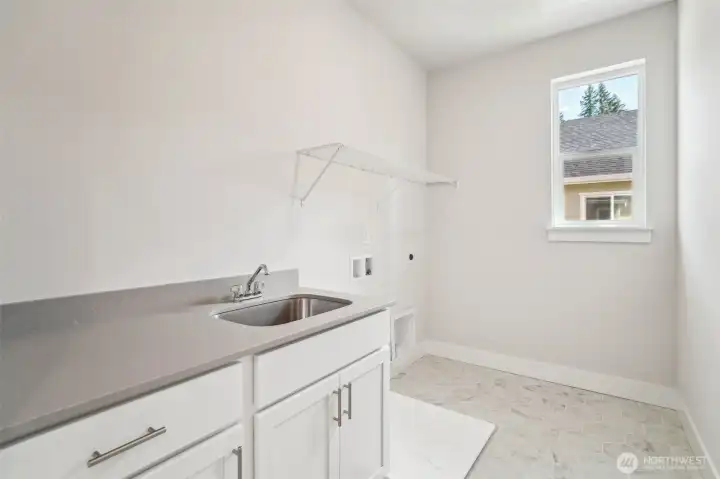 Laundry room -w/qtz, cabinet w/sink