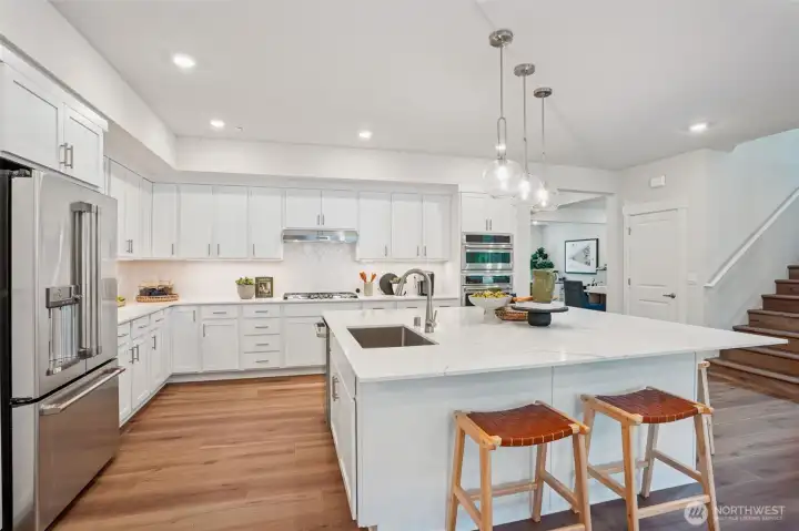 Can you imagine this being YOUR kitchen????  That island is absolutely amazing.  Plenty of room for bar stools.  This is an entertainers dream kitchen.