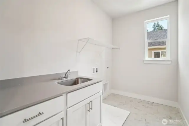 Laundry room -w/qtz, cabinet w/sink