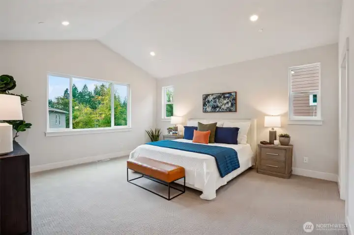 Huge primary bdrm.  Large windows, pitched ceiling, can lights and prewire for ceiling fan. Huge spa-like bath off bdrm.