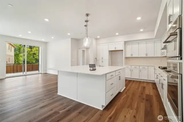 Beautiful Kitchen and HUGE .  Massive cabinets/drawers. Under cabinet lighting and quarts counters