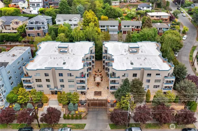 Ground level unit in Building A (left side) with patio & community amenities.