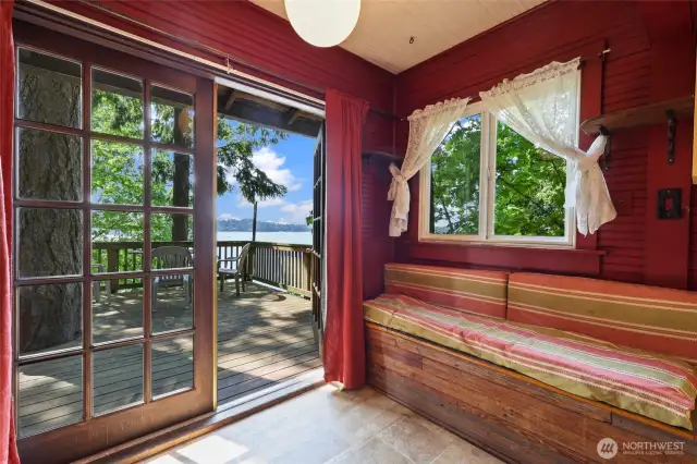 Window seat in dinning area, looking out at the water.