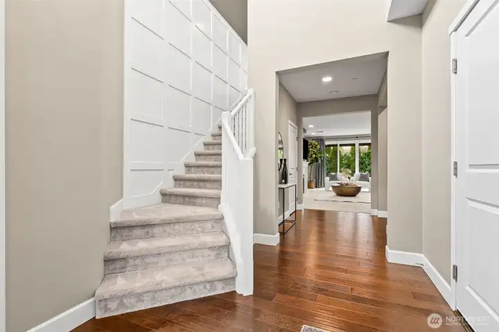 Vaulted ceiling, board and batten wall detail and hardwoods welcome you as you enter the home.
