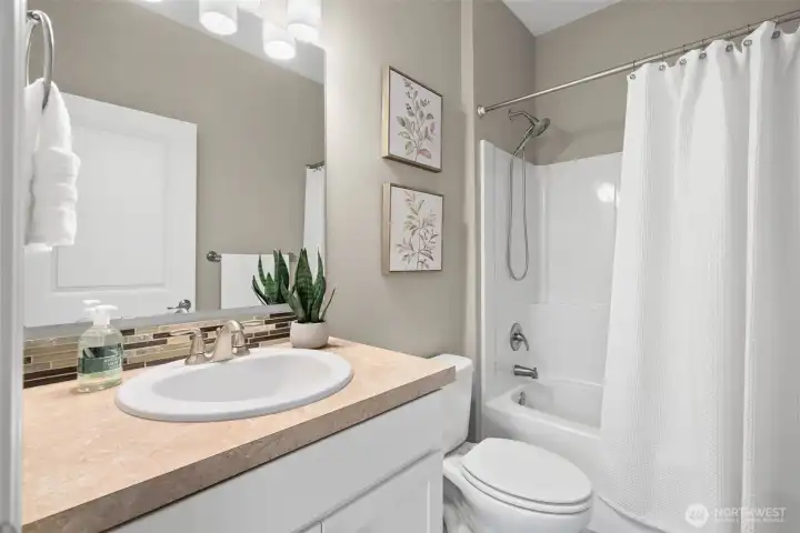 Full bath on 2nd floor is ideal for this bedroom layout on the 2nd floor.  Double sinks in this main bath makes this room easy to share between the two bedrooms on the 2nd floor.