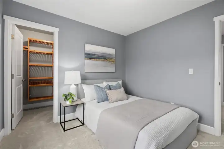 Bedroom 1 upstairs with walk in closet and more customized closet organizer.