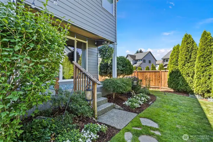 Step down from your covered patio space into this perfect sized backyard retreat