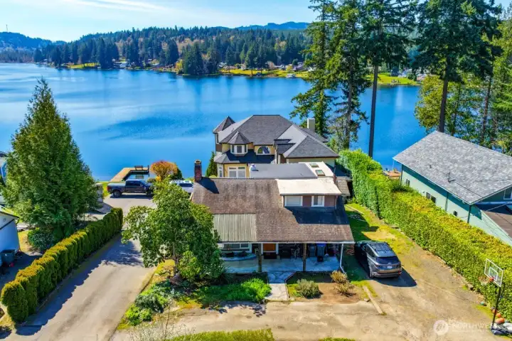 This 2,167 SF log home has a great view of Kitsap Lake from the deck!