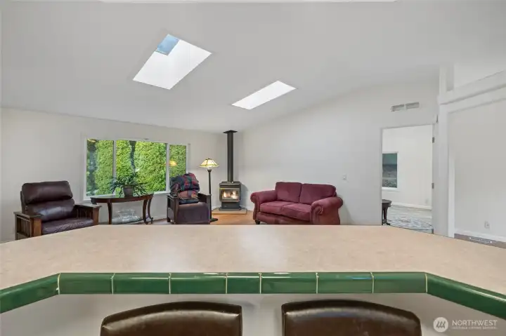 view into the living room from the bar in the kitchen