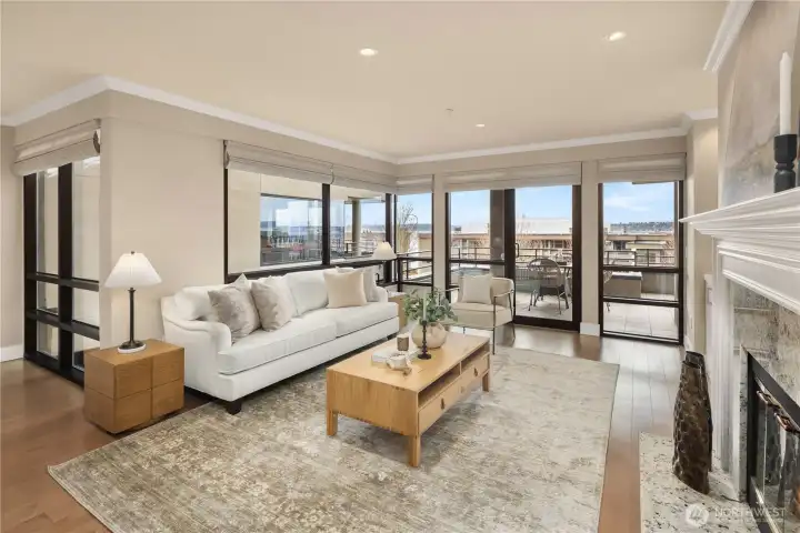 Open-concept living areas are bathed in natural light, seamlessly extending through a wall of windows to an expansive covered patio—perfect for year-round enjoyment.